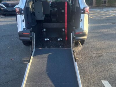 White Toyota Sienna with Driverge Rear Entry Manual Fold Out conversion
