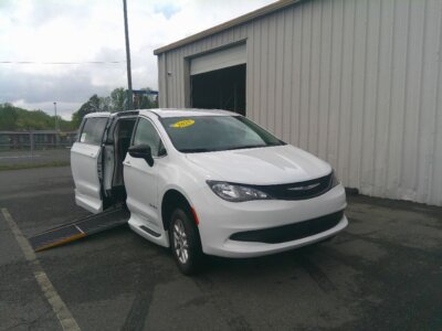 White Chrysler Voyager with Driverge Side Entry Automatic Fold Out conversion