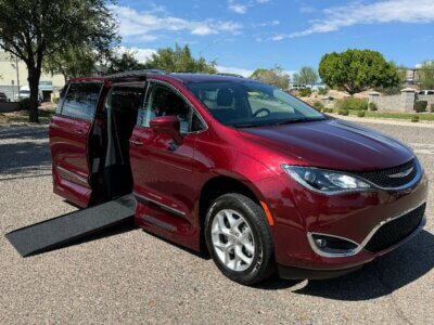 Red Chrysler Pacifica with Vantage Mobility Side Entry Automatic In Floor conversion