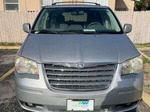 Silver Chrysler Town and Country with BraunAbility Side Entry Automatic Fold Out conversion