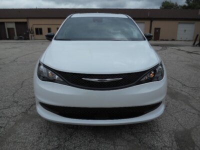 White Chrysler Voyager with FR Conversions Rear Entry Manual Fold Out conversion