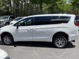 White Chrysler Voyager with FR Conversions Rear Entry Manual Fold Out conversion