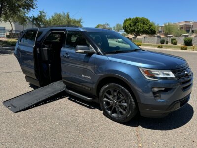 Blue Ford Explorer with BraunAbility Side Entry Automatic In Floor conversion