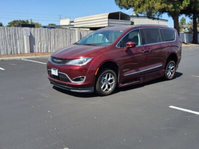 Red Chrysler Pacifica with BraunAbility Side Entry Automatic In Floor conversion