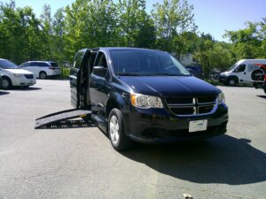 Black Dodge Grand Caravan with BraunAbility Side Entry Automatic Fold Out conversion