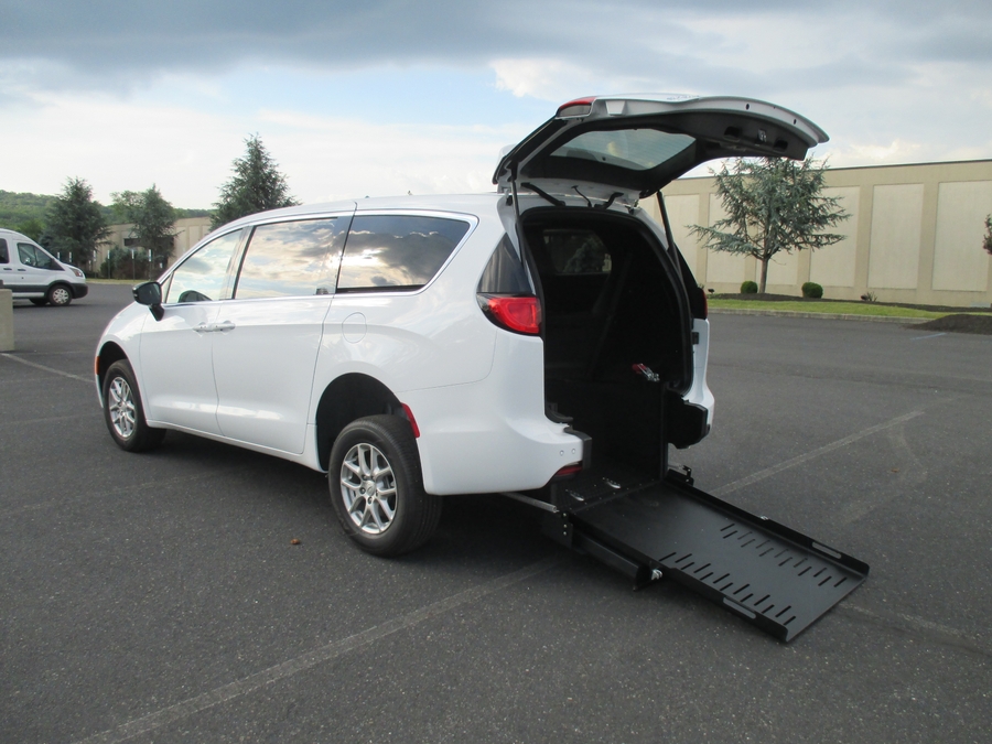 White Chrysler Voyager with FR Conversions Rear Entry Manual Fold Out conversion