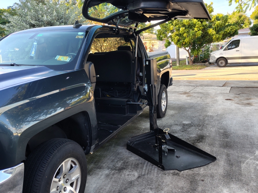 Blue Chevrolet Silverado 1500 with ATC Side Entry Automatic Fold Out conversion