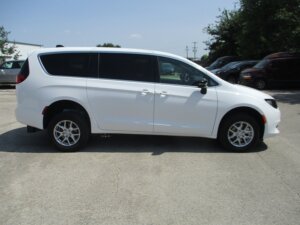 White Chrysler Voyager with FR Conversions Rear Entry Manual Fold Out conversion