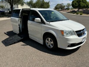 White Dodge Grand Caravan with BraunAbility Side Entry Manual Fold Out conversion