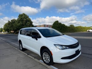 White Chrysler Voyager with FR Conversions Rear Entry Manual Fold Out conversion