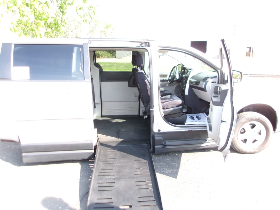 Silver Dodge Grand Caravan with BraunAbility Side Entry Automatic Fold Out conversion