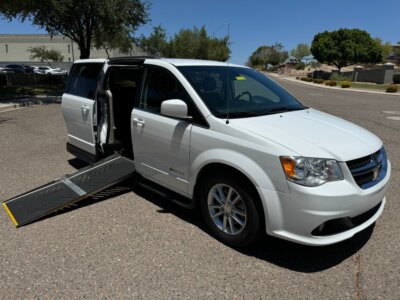 White Dodge Grand Caravan with Driverge Side Entry Automatic Fold Out conversion