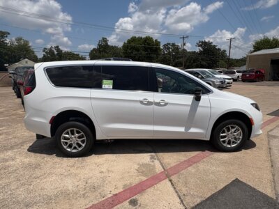 White Chrysler Voyager with FR Conversions Rear Entry Manual Fold Out conversion