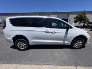 White Chrysler Voyager with FR Conversions Rear Entry Manual Fold Out conversion