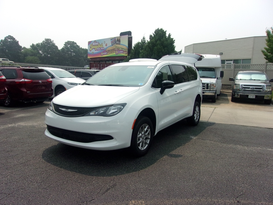 White Chrysler Voyager with FR Conversions Rear Entry Manual Fold Out conversion