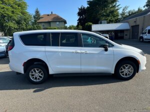 White Chrysler Voyager with FR Conversions Rear Entry Manual Fold Out conversion