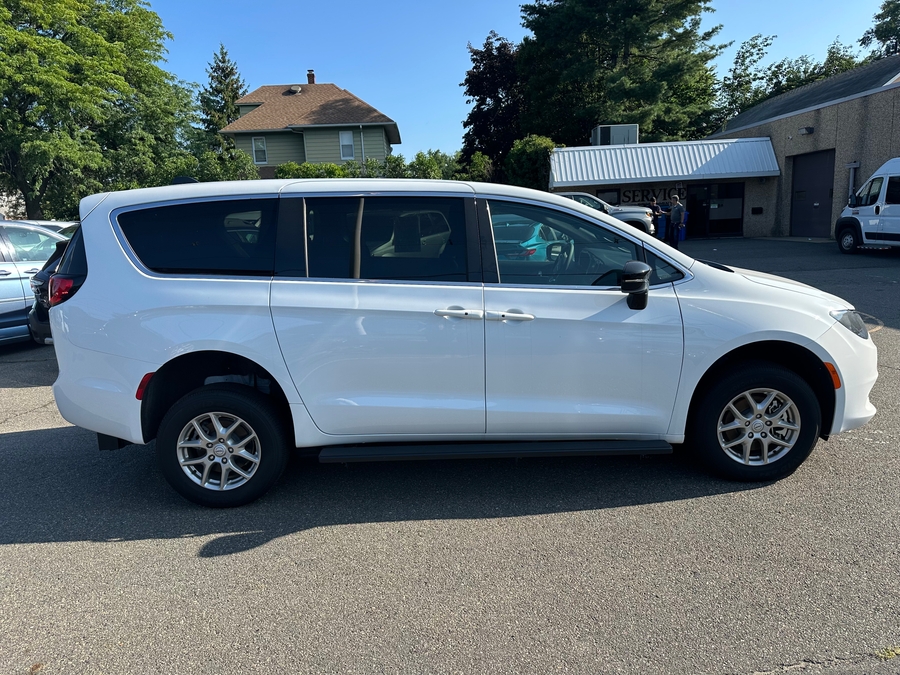 White Chrysler Voyager with FR Conversions Rear Entry Manual Fold Out conversion