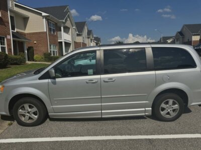 Silver Dodge Grand Caravan with BraunAbility Side Entry Automatic Fold Out conversion
