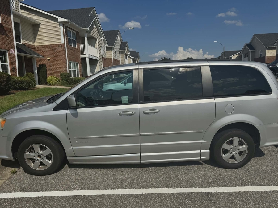 Silver Dodge Grand Caravan with BraunAbility Side Entry Automatic Fold Out conversion
