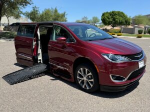 Red Chrysler Pacifica with BraunAbility Side Entry Automatic Fold Out conversion