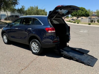 Blue Kia Sorento with Freedom Motors Rear Entry Automatic Fold Out conversion