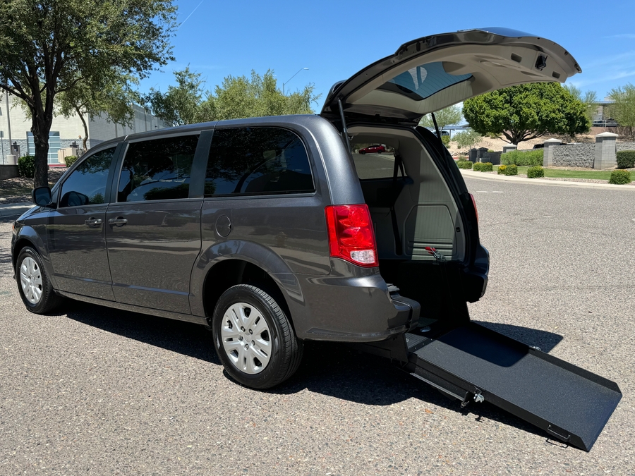 Grey Dodge Grand Caravan with International Sales and Mobility Rear Entry Manual Fold Out conversion