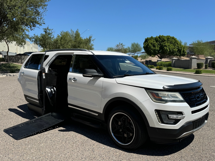 White Ford Explorer with BraunAbility Side Entry Automatic In Floor conversion