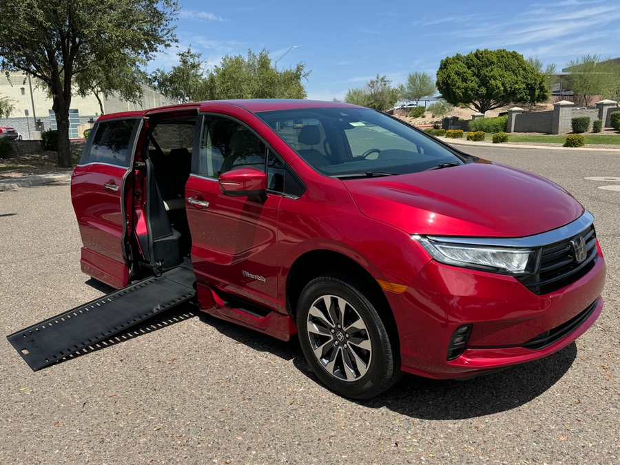 Red Honda Odyssey with BraunAbility Side Entry Automatic In Floor conversion