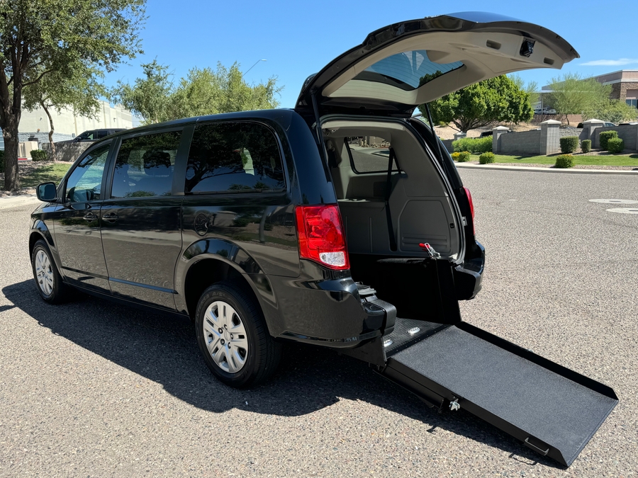 Black Dodge Grand Caravan with International Sales and Mobility Rear Entry Manual Fold Out conversion