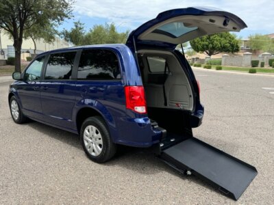 Blue Dodge Grand Caravan with International Sales and Mobility Rear Entry Manual Fold Out conversion