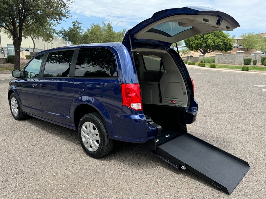 Blue Dodge Grand Caravan with International Sales and Mobility Rear Entry Manual Fold Out conversion