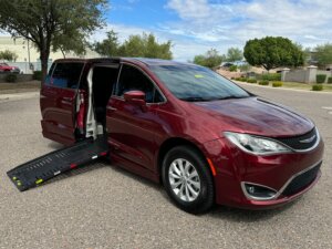 Red Chrysler Pacifica with BraunAbility Side Entry Automatic Fold Out conversion
