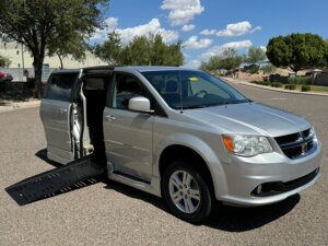 Silver Dodge Grand Caravan with BraunAbility Side Entry Automatic Fold Out conversion