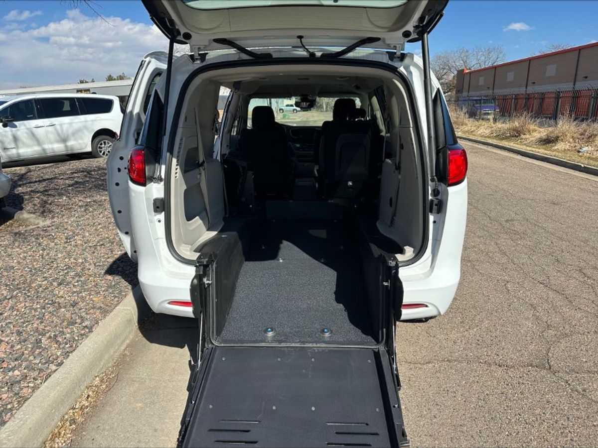 White Chrysler Voyager with BraunAbility Rear Entry Manual Fold Out conversion