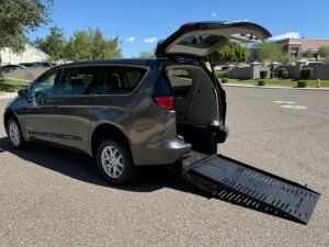 Grey Chrysler Voyager with BraunAbility Rear Entry Manual Fold Out conversion