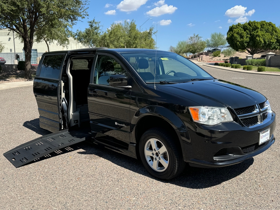 Black Dodge Grand Caravan with BraunAbility Side Entry Automatic Fold Out conversion