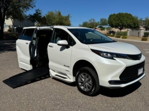 White Toyota Sienna with BraunAbility Side Entry Automatic Fold Out conversion