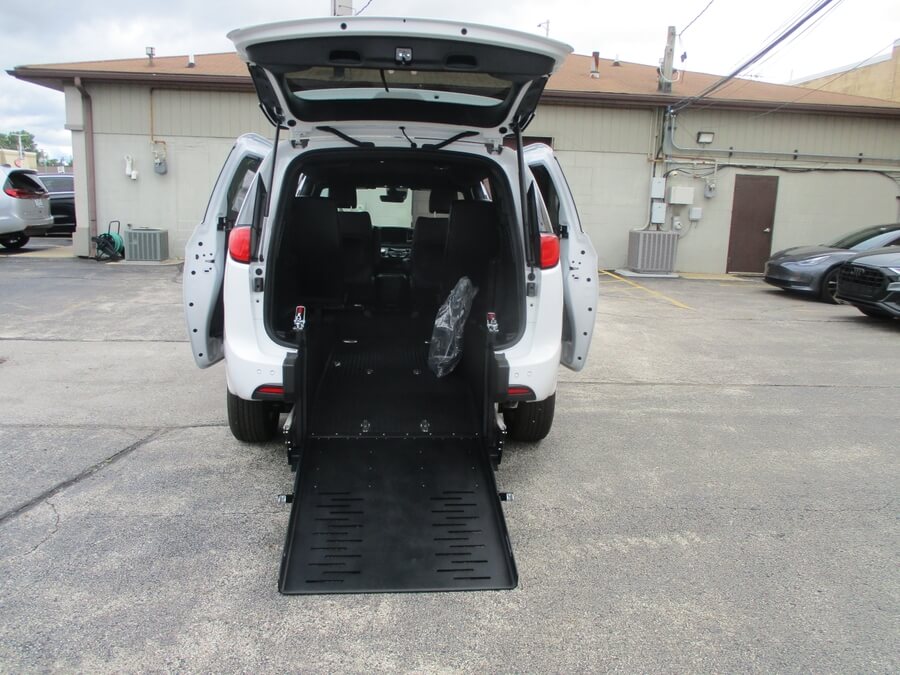 White Chrysler Voyager with FR Conversions Rear Entry Manual Fold Out conversion