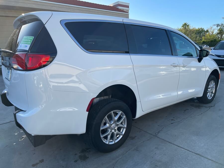 White Chrysler Voyager with FR Conversions Rear Entry Manual Fold Out conversion