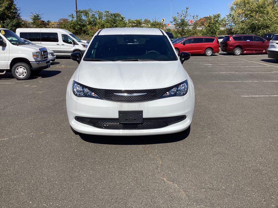 White Chrysler Voyager with FR Conversions Rear Entry Manual Fold Out conversion