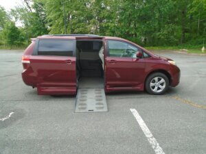 Red Toyota Sienna with BraunAbility Side Entry Automatic Fold Out conversion